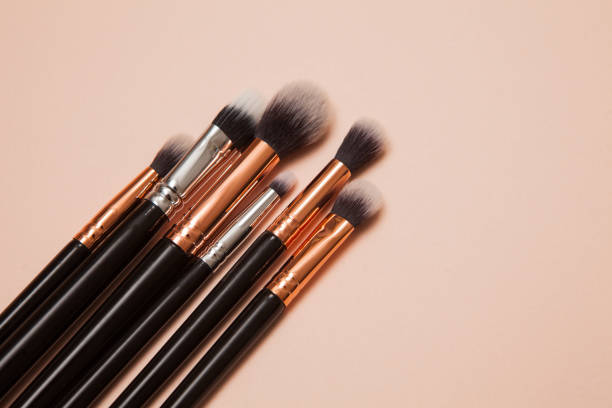 istock Various Cosmetic Brushes on Pink Background. Makeup Brushes Set for Take Care Skin. 1313953854
