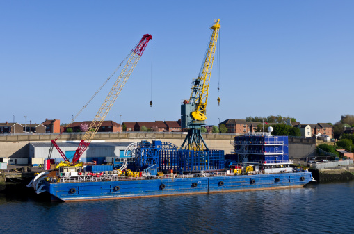 Cable Laying Barge and Cranes in port. Sunderland UK