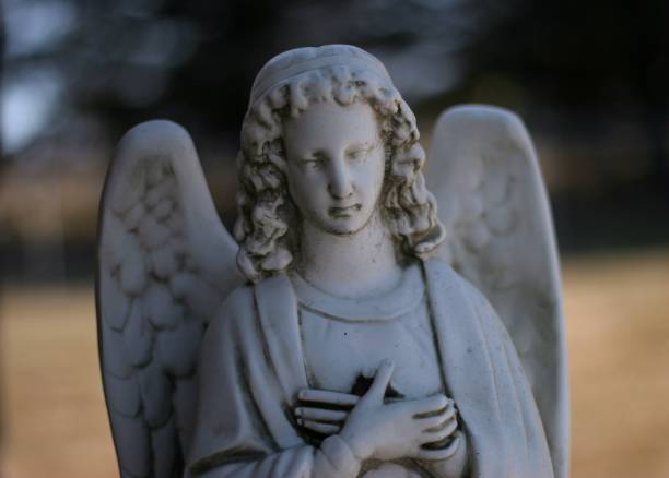 istock Angel statue on tombstone 1313955394