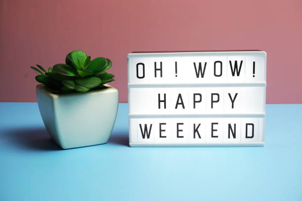 istock Happy Weekend word in light box on blue and pink background 1313957128