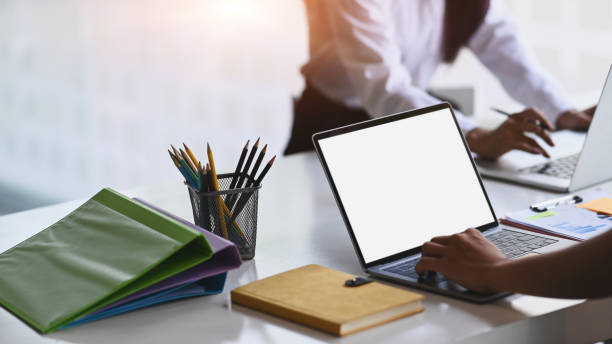 istock Cropped shot of businessman using computer laptop during meeting on white table. 1313957813