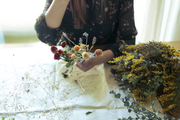 istock A woman making a swag with dried flowers 1313958548