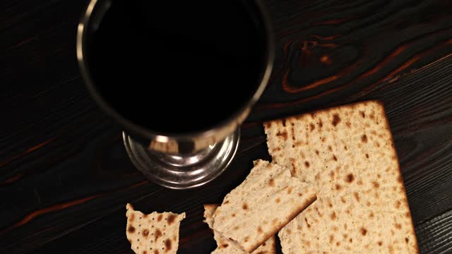 holy communion chalice with wine and bread. Super slow motion