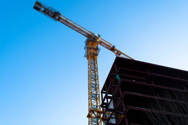 istock Construction site. Building site with crane. Concrete building under construction 1313959641