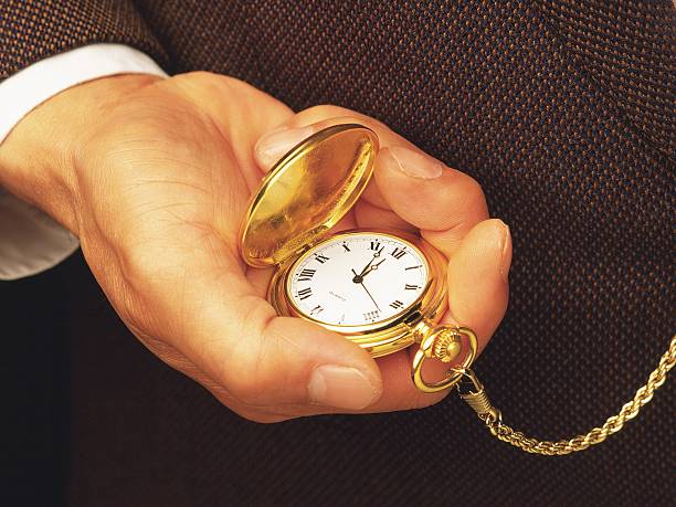 istock businessman and his gold watch 131396267