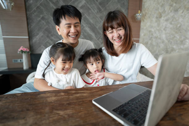 istock Social teleconferencing, Asian daughters and single mothers take online classes Via a computer with a wireless internet system. 1313962725