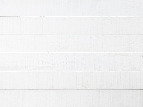 Old weathered abstract white-colored paneled oak wood background with lots of wood grain and texture.