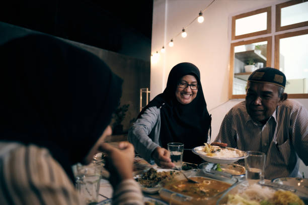 istock Lovely Muslim Break Fasting Together 1313964737