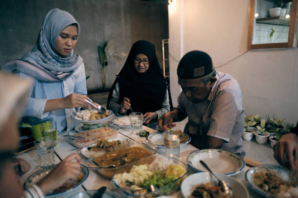 istock Lovely Muslim Break Fasting Together 1313964753