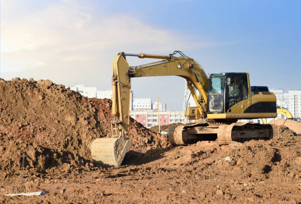 istock Excavator on earthworks at construction site. Backhoe on earthmoving and foundation work 1313964994