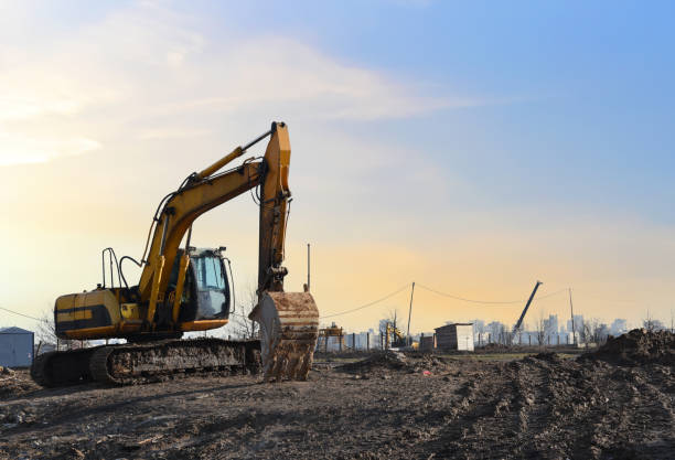 istock Excavator on earthworks at construction site. Backhoe on earthmoving and foundation work 1313965010