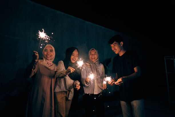 istock Lovely Group of Muslim Playing Fireworks Celebrating Eid Mubarak 1313965952