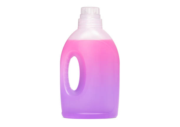 istock Detergent bottle, pink liquid washing soap for textile, isolated on white 1313966017