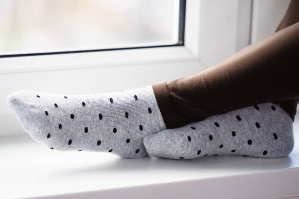 Woman wearing grey dotted socks