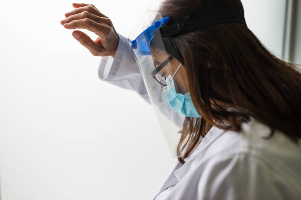 istock Sad, sick, overworked, female health care worker 1313967344