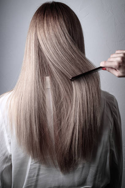 istock Women's blonde long hair 1313970698