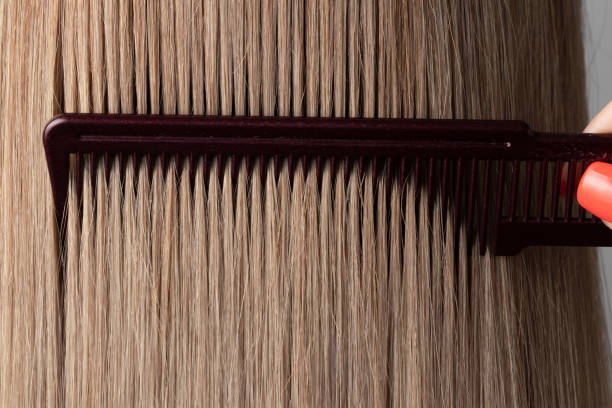istock Combing straight blonde smooth hair 1313970801