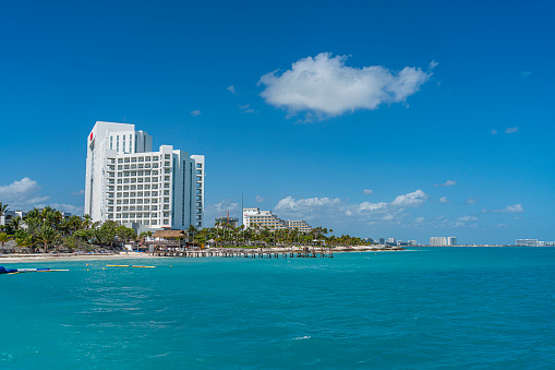Cancun, Mexico - March 10.2021: View from the Hotel Zone, Cancun with the Riu Hotel from the beautiful turquoise Ocean