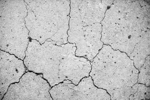 istock Concrete with Crack background. Old broken Cement Floor Wall. Chapped stone asphalt surface texture 1313971777