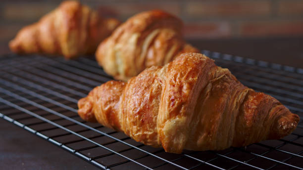 istock freshly baked croissant by trusting a metal grille 1313973784