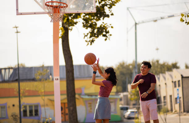 istock Young couple playing basketball. 1313973847