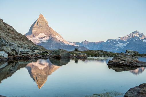 Sunlight on the top of the peak , reflection on water surface.
Valais, Switzerland