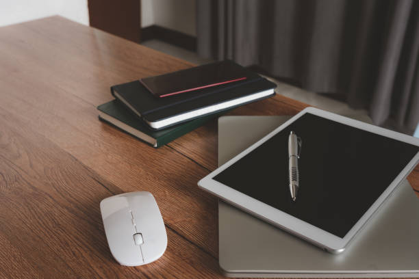 istock Essential accessories of working on table at office workplace.  pen laptop mouse device notebook mobile phone .copy space. Business and finance idea objects concept background. 1313975803