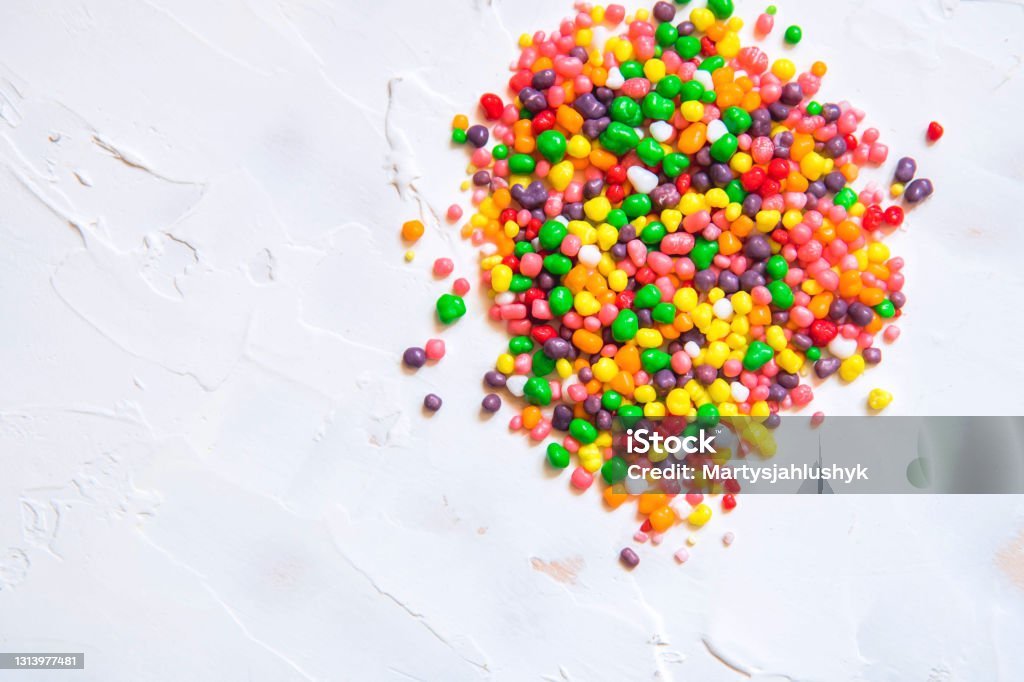 Rainbow colored candy nerds sprinkled on a white background Rainbow colored candy nerds sprinkled on a white background. Nerd Stock Photo