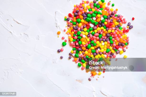Rainbow Colored Candy Nerds Sprinkled On A White Background Stock Photo - Download Image Now
