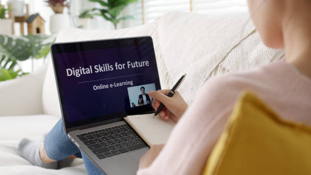 istock Rear view young asian woman listen watch digital class e-learning online for employee reskill upskill on notebook computer at home office workplace. Business school lesson education for adult people. 1313978079