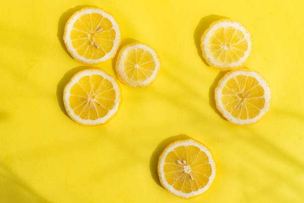 istock Lemons on a yellow background . Sliced lemon. Yellow fruit. Lemon copy space layout . 1313978798