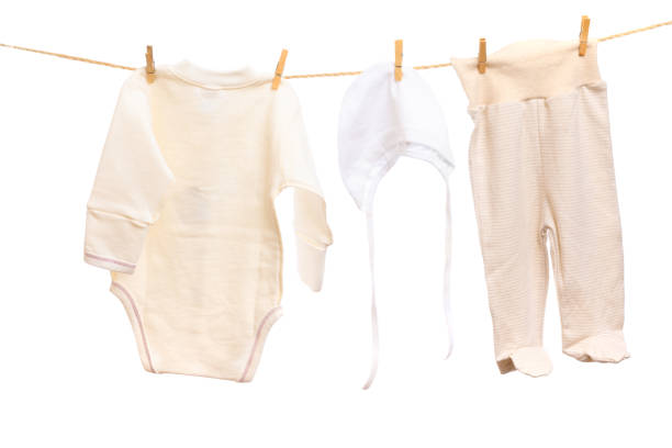 istock Baby clothes on a clothesline on white  background - Image 1313978831