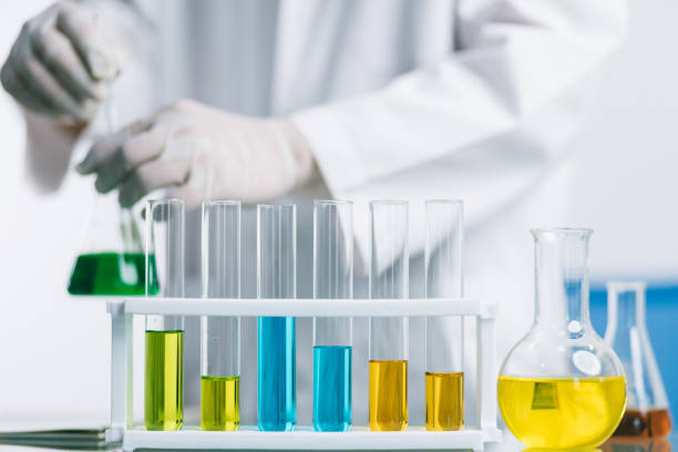 istock Biochemical research scientist working with science laboratory test tubes for coronavirus vaccine development in pharmaceutical research labolatory 1313980151