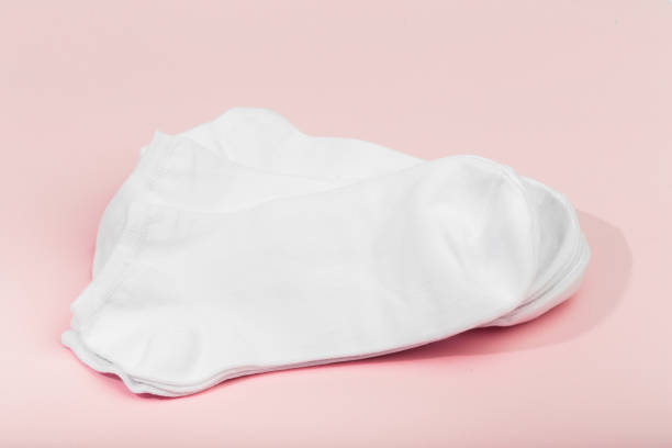 istock stack of white socks on pink background - Imagr 1313980356
