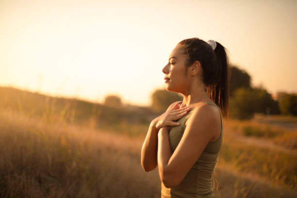 istock Young woman practicing breathing yoga. 1313980540
