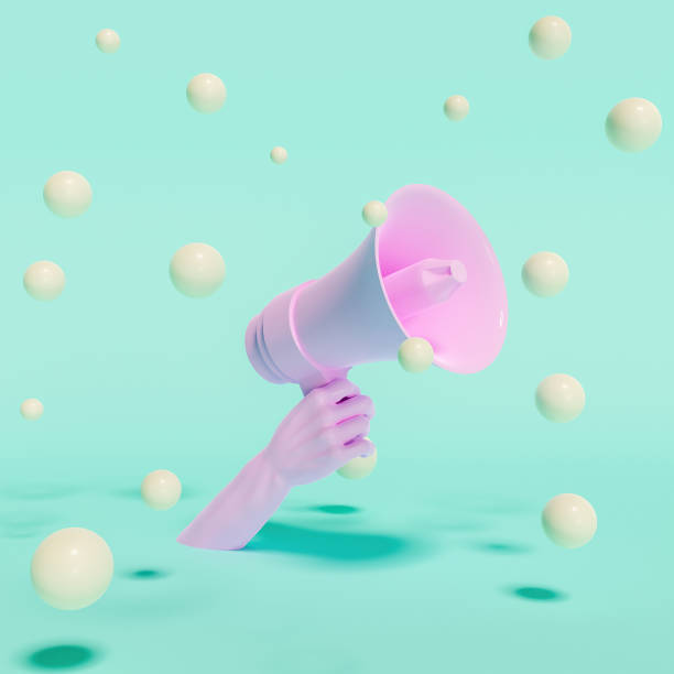 istock hand holding a megaphone with floating spheres around it 1313982409