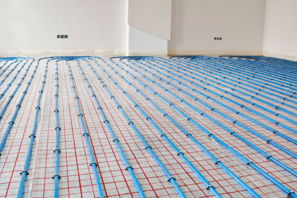 istock Blue plastic pipes of underfloor heating indoors 1313983727