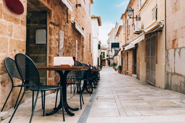 istock Empty tables of street cafe, Spain 1313985361