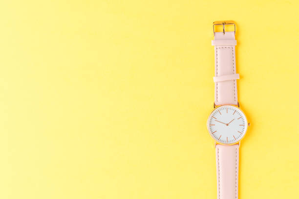 istock Women’s wrist watch on yellow background 1313986097