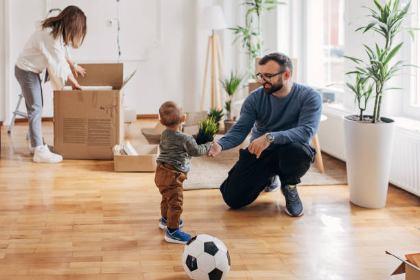 istock Couple with son in their new home 1313988630