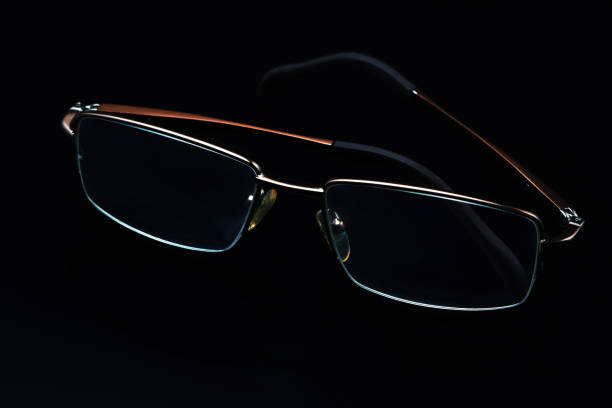 istock Glasses in fashionable frames on a black background. Close up 1313989913