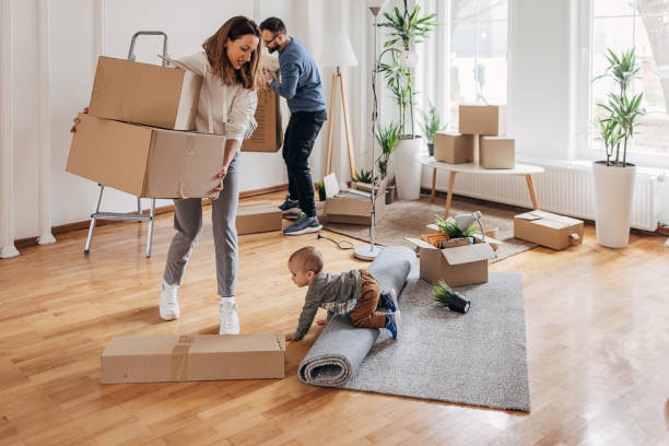 istock Couple with son moving in their new home 1313991794