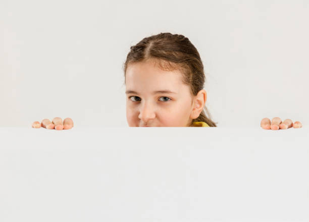 istock Caucasian girl isolated on white studio background. Copyspace. Childhood, education, emotions concept 1313991849