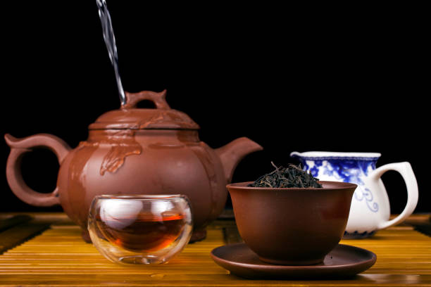istock Clay teapot with smoked red tea Lapsang souchong 1313992100