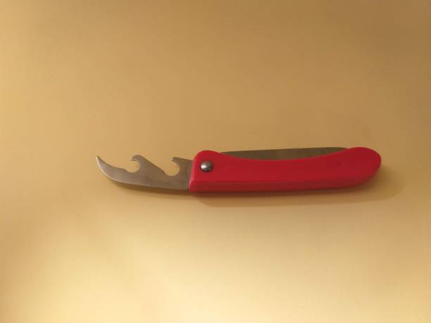 istock Red bottle opener on yellow background 1313993193