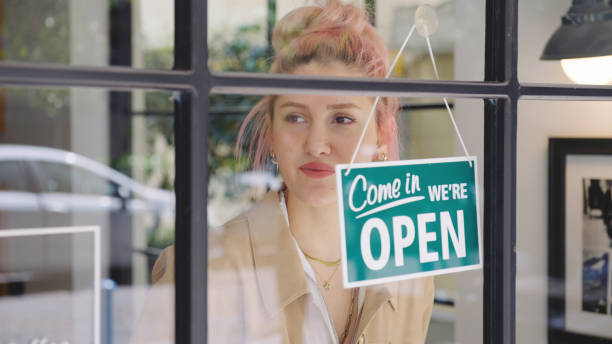 istock Small business owner opening a shop 1313993268
