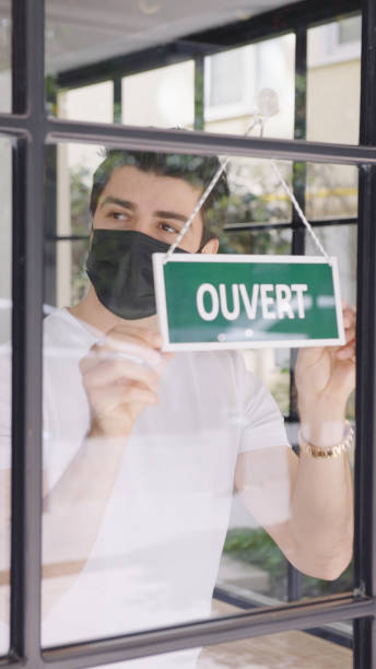 istock French small business owner opening a shop 1313993292