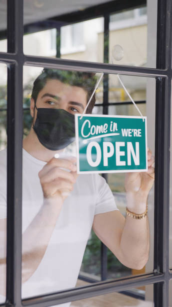 istock Small business owner opening a shop 1313993303