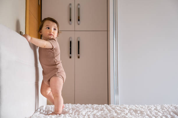 istock toddler boy having fun alone in his bed 1313994125