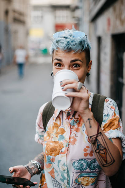 Punk woman drinking coffee